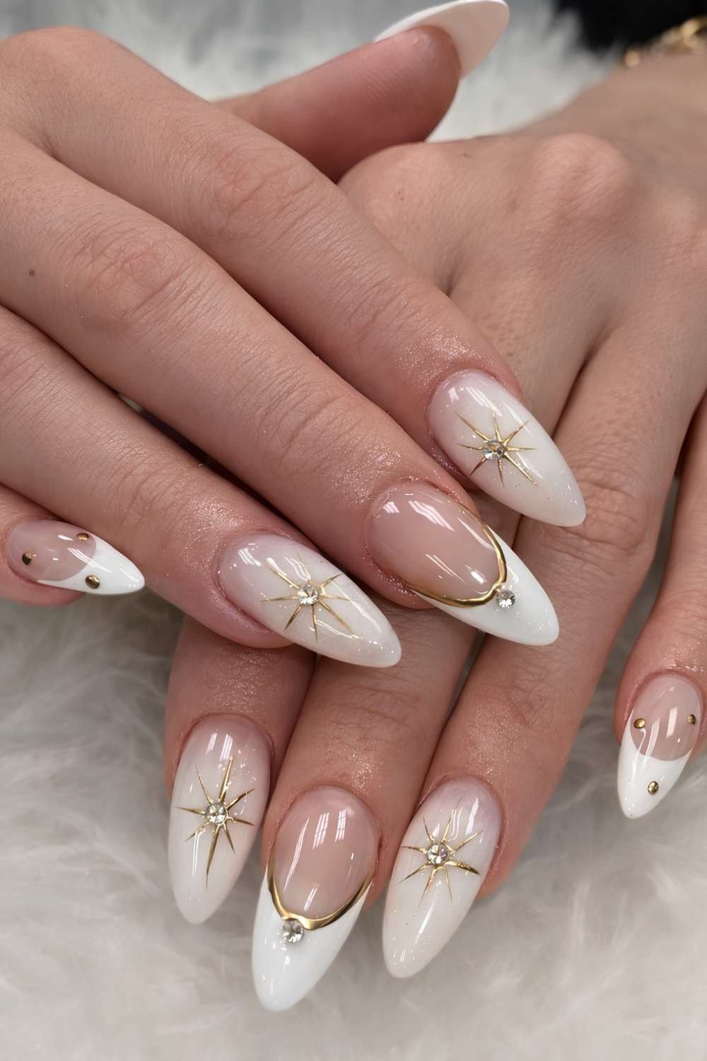 White french with gold starbursts nails for women over 50 - classy winter nail idea 14