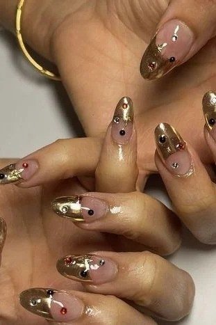 Gold glitter almond nails for women over 50 - classy winter nail idea 18