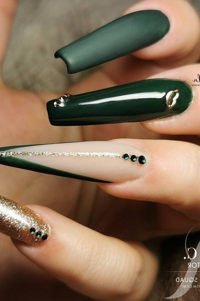 Emerald stiletto with gold glitter accent nails for women over 50 - classy winter nail idea 22