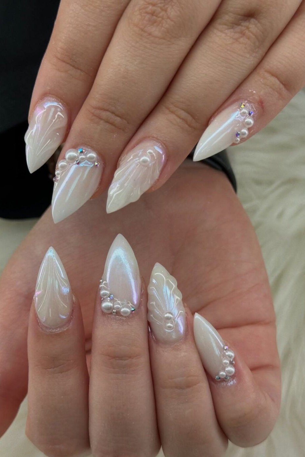 Nude stiletto with white snowflake nails for women over 50 - classy winter nail idea 23