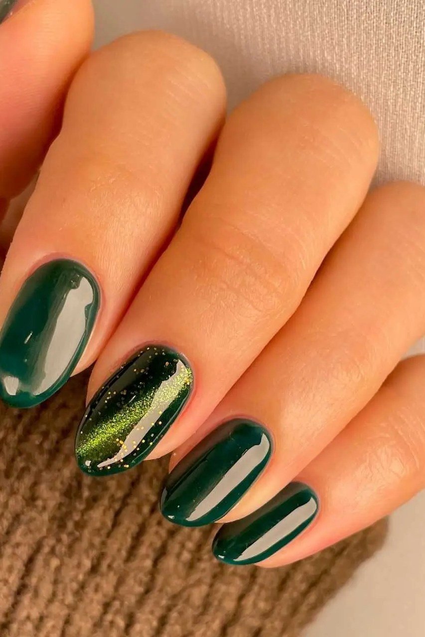 Emerald almond with gold cat-eye shimmer nails for women over 50 - classy winter nail idea 25