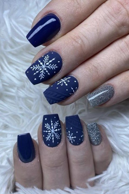 Navy with white snowflake square nails for women over 50 - classy winter nail idea 30