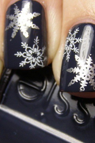 Navy with white snowflake almond nails for women over 50 - classy winter nail idea 33