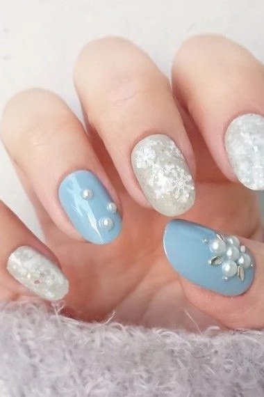 Blue almond with white snowflake nails for women over 50 - classy winter nail idea 34