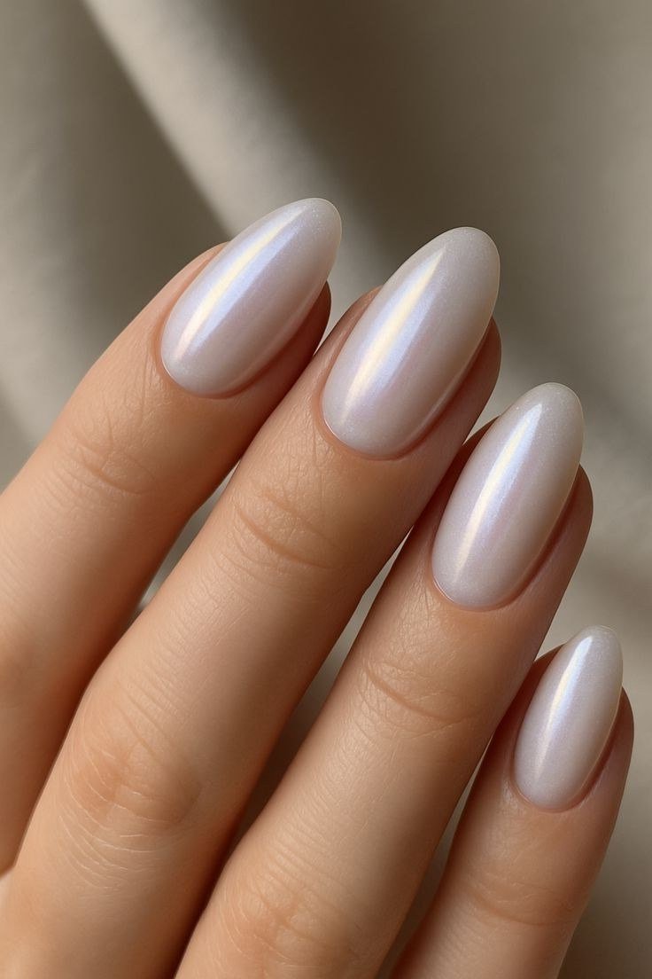 Pearl white almond nails for women over 50 - classy winter nail idea 42