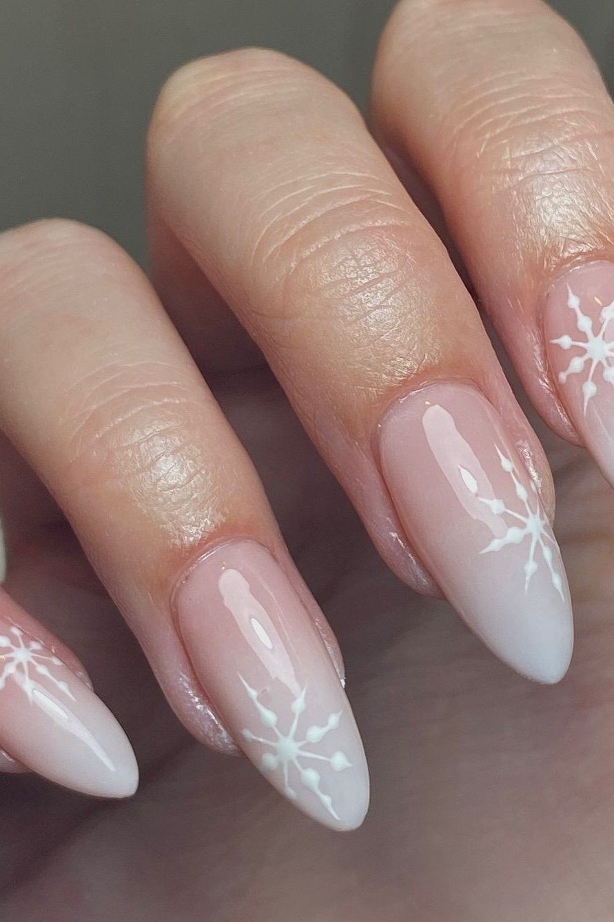 White ombre with snowflake almond nails for women over 50 - classy winter nail idea 43