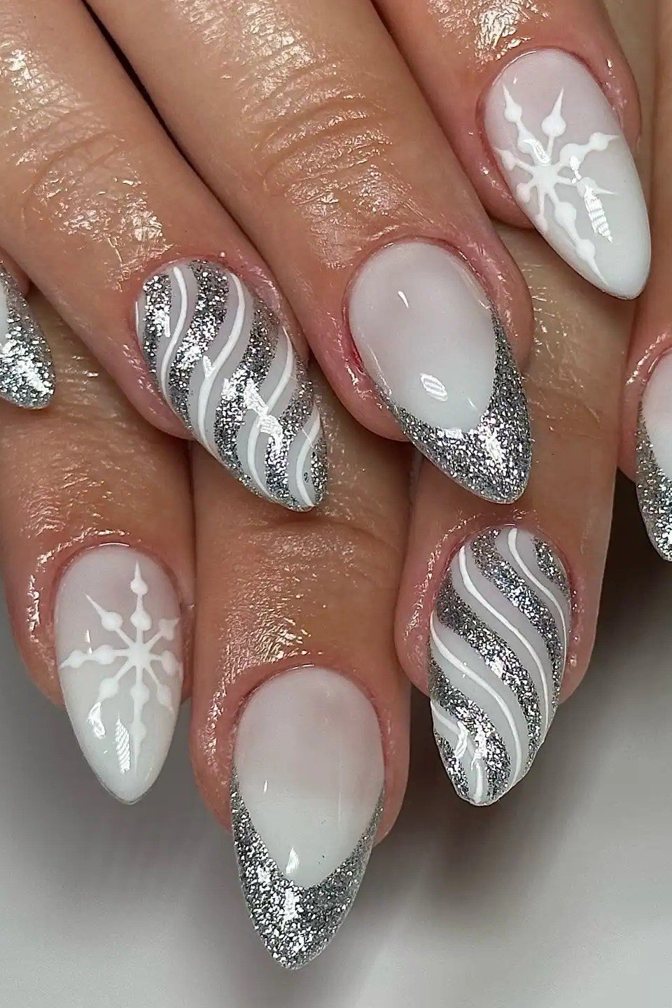 White with silver snowflake stiletto nails for women over 50 - classy winter nail idea 44