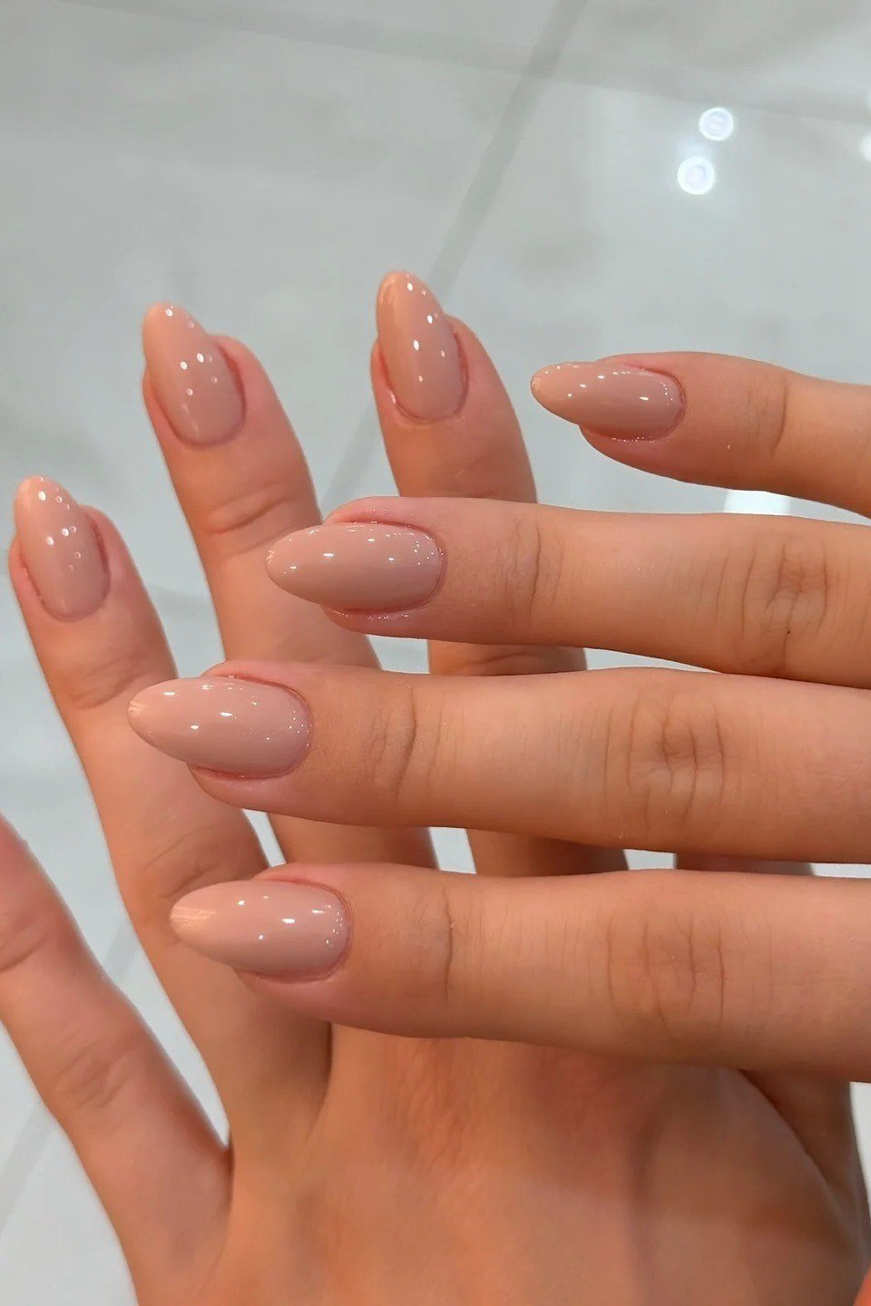 Glossy nude almond nails for women over 50 - classy winter nail idea 46