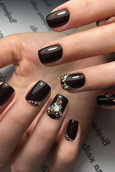 Chocolate with gold glitter almond nails for women over 50 - classy winter nail idea 57