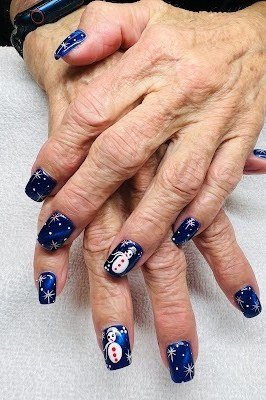 Blue snowman art, mature hands nails for women over 50 - classy winter nail idea 58