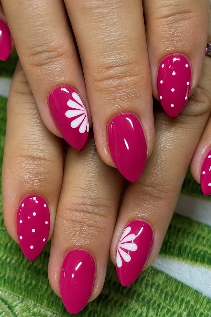 fuchsia almond nails with white daisy art and dot accents