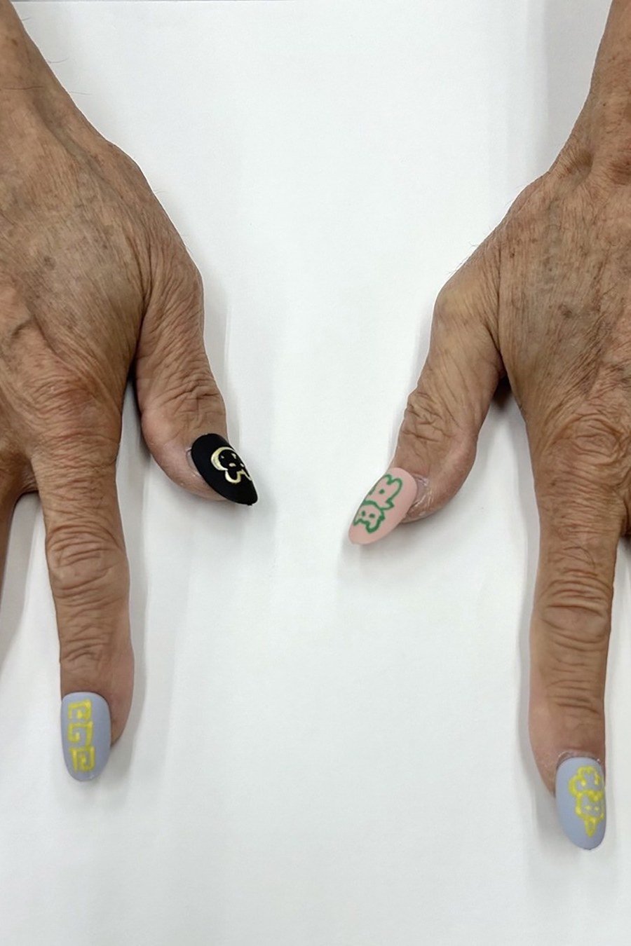 mismatched pastel multi-color short nails on both hands
