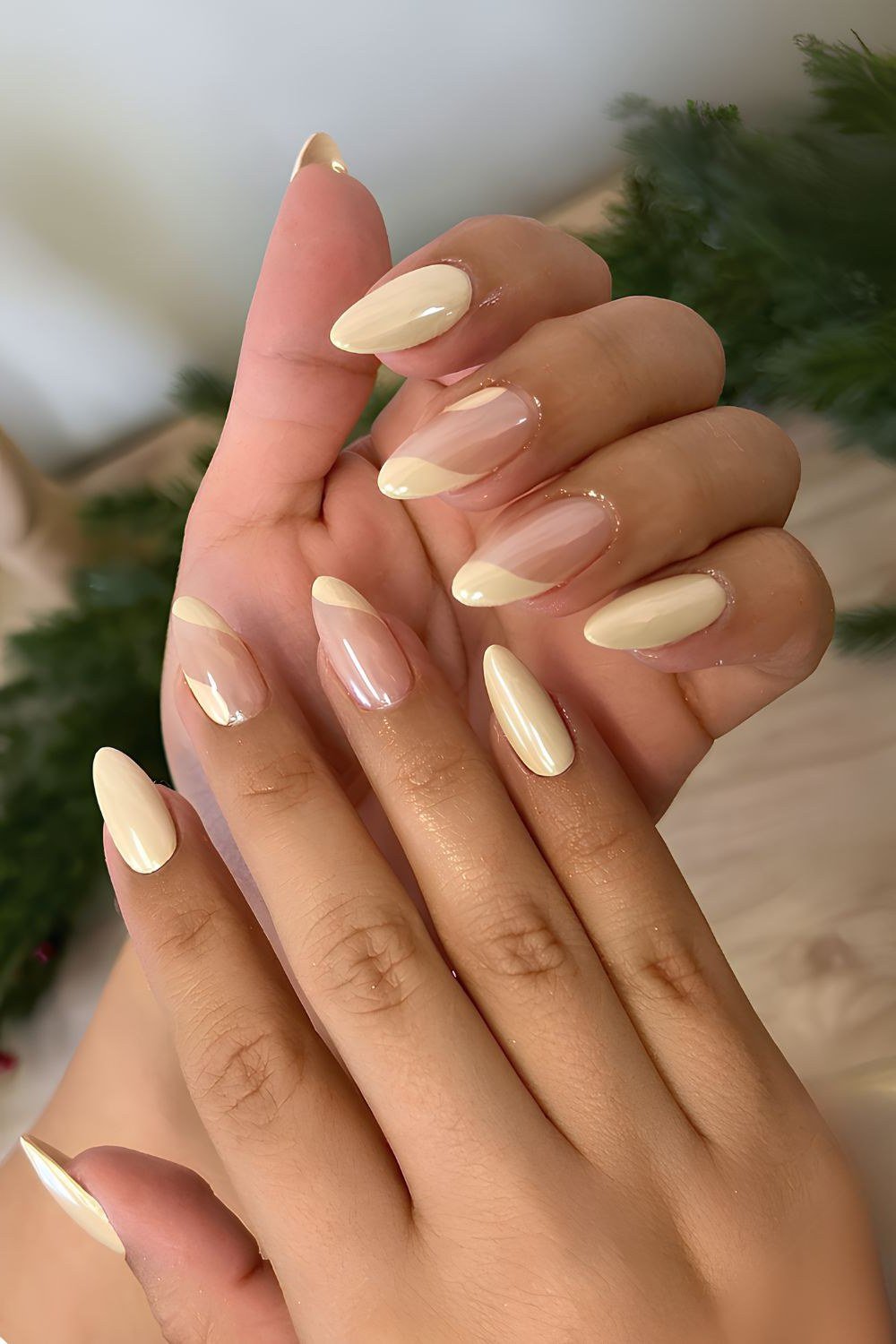 Cream chrome almond nails on two hands - caramel nude nail idea for women over 50