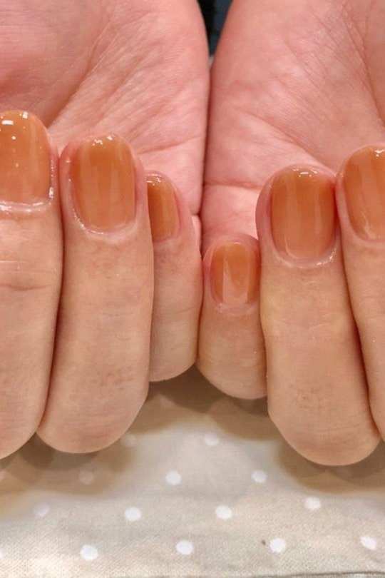 Translucent caramel jelly nails, palms view - caramel nude nail idea for women over 50