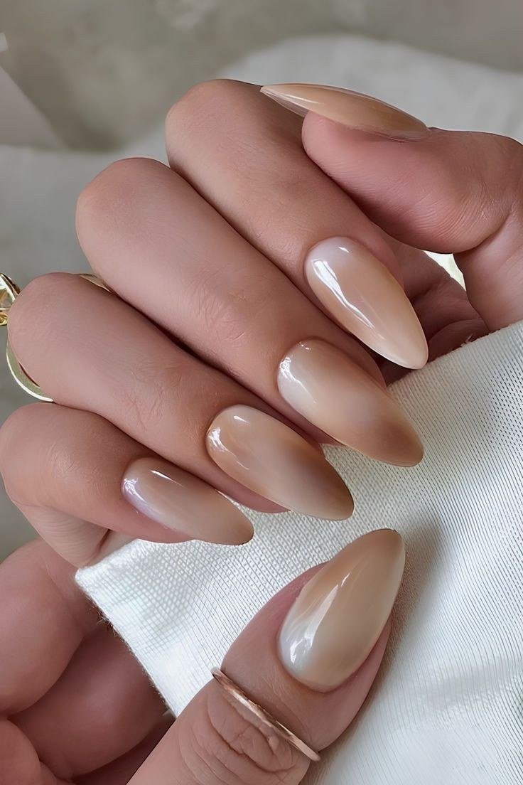 Caramel ombre almond nail set on two hands - caramel nude nail idea for women over 50