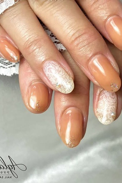 Caramel nails with gold glitter accent and lace cuff - caramel nude nail idea for women over 50