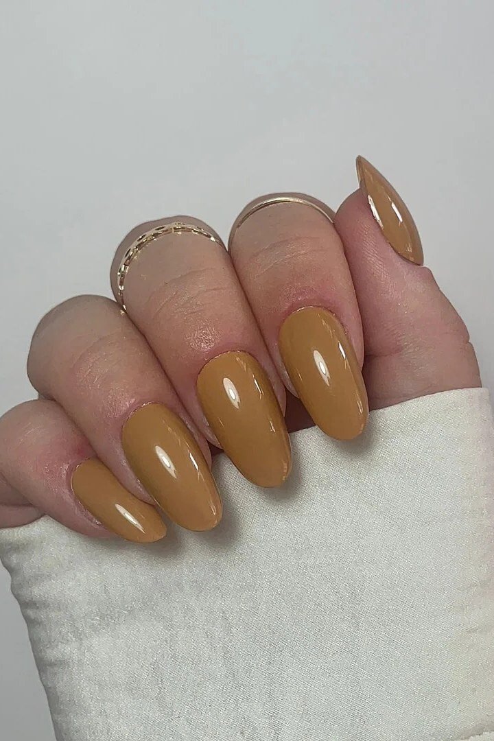 Deep caramel brown oval nails - caramel nude nail idea for women over 50