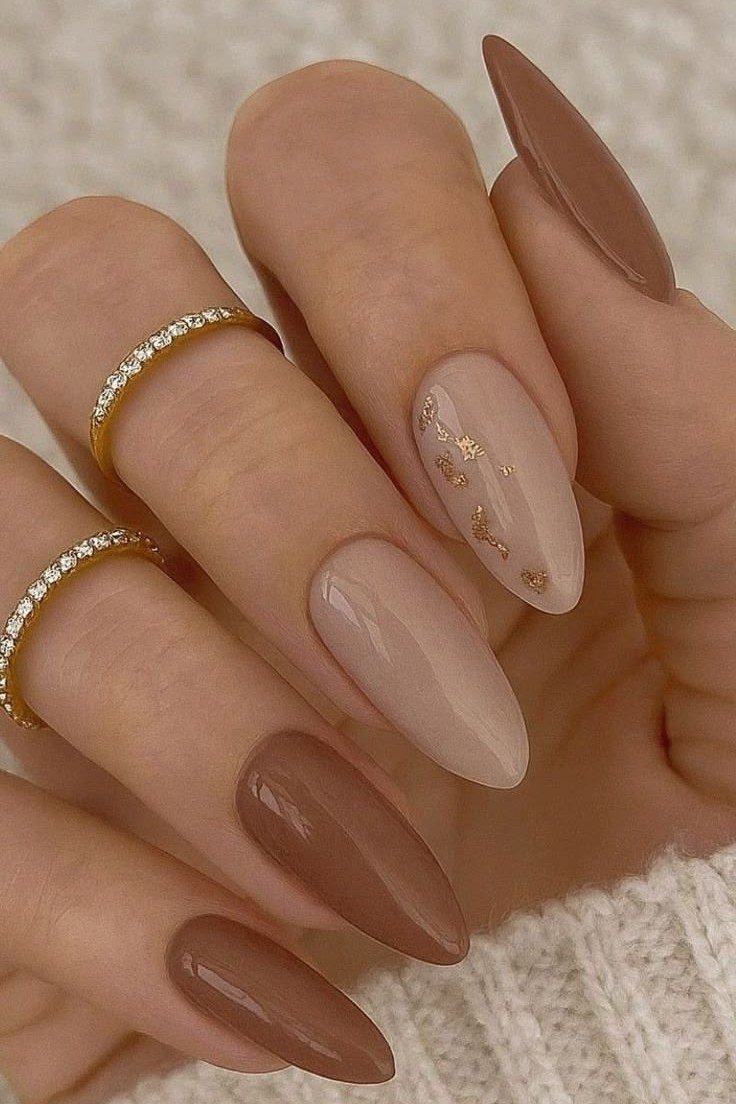 Nude-to-brown two-tone almond nails with gold lines - caramel nude nail idea for women over 50