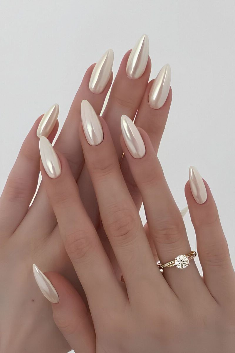 Long almond nails in luminous pearl white for women over 50