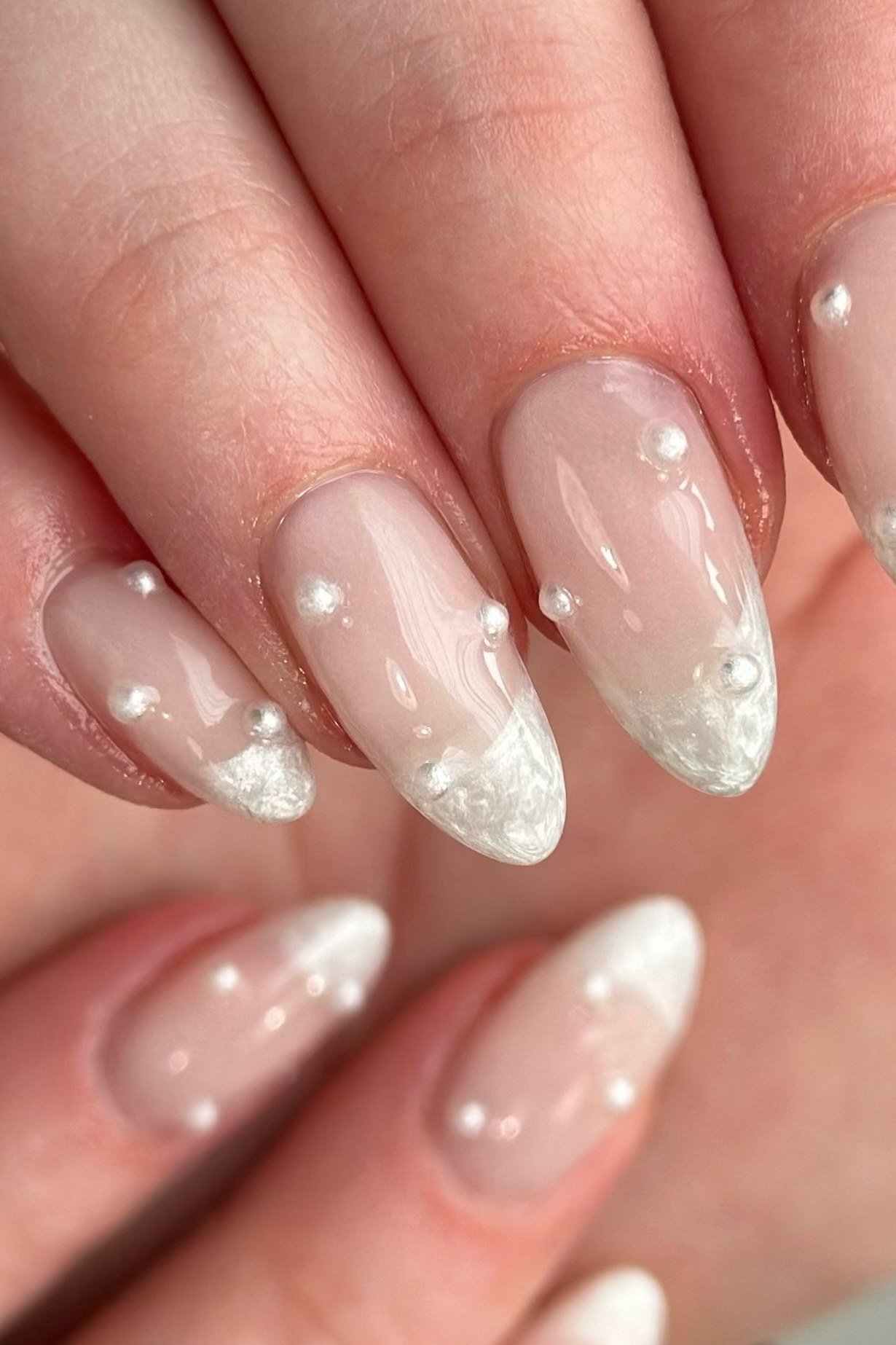 Sheer pearl nails with floating pearl dots for women over 50