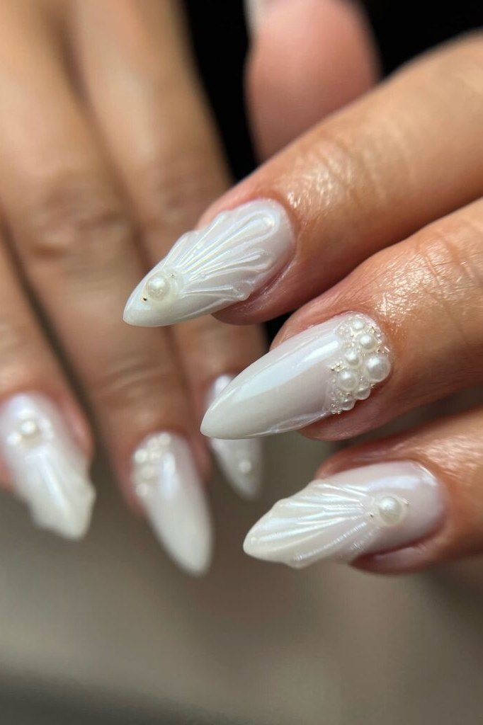 White pearl nails with shell art for women over 50