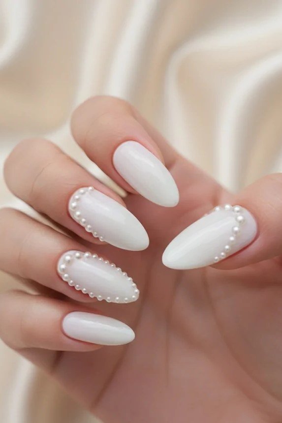 White almond nails edged with pearl beads for women over 50