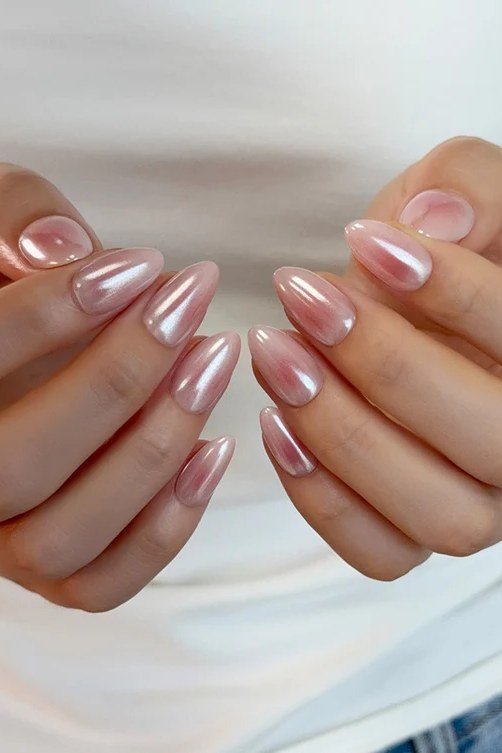 Pearl pink nails, both hands shown for women over 50