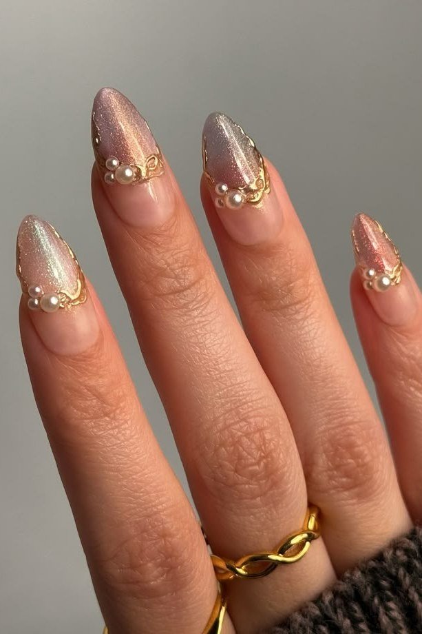 Pearl nails with gold chrome tips for women over 50