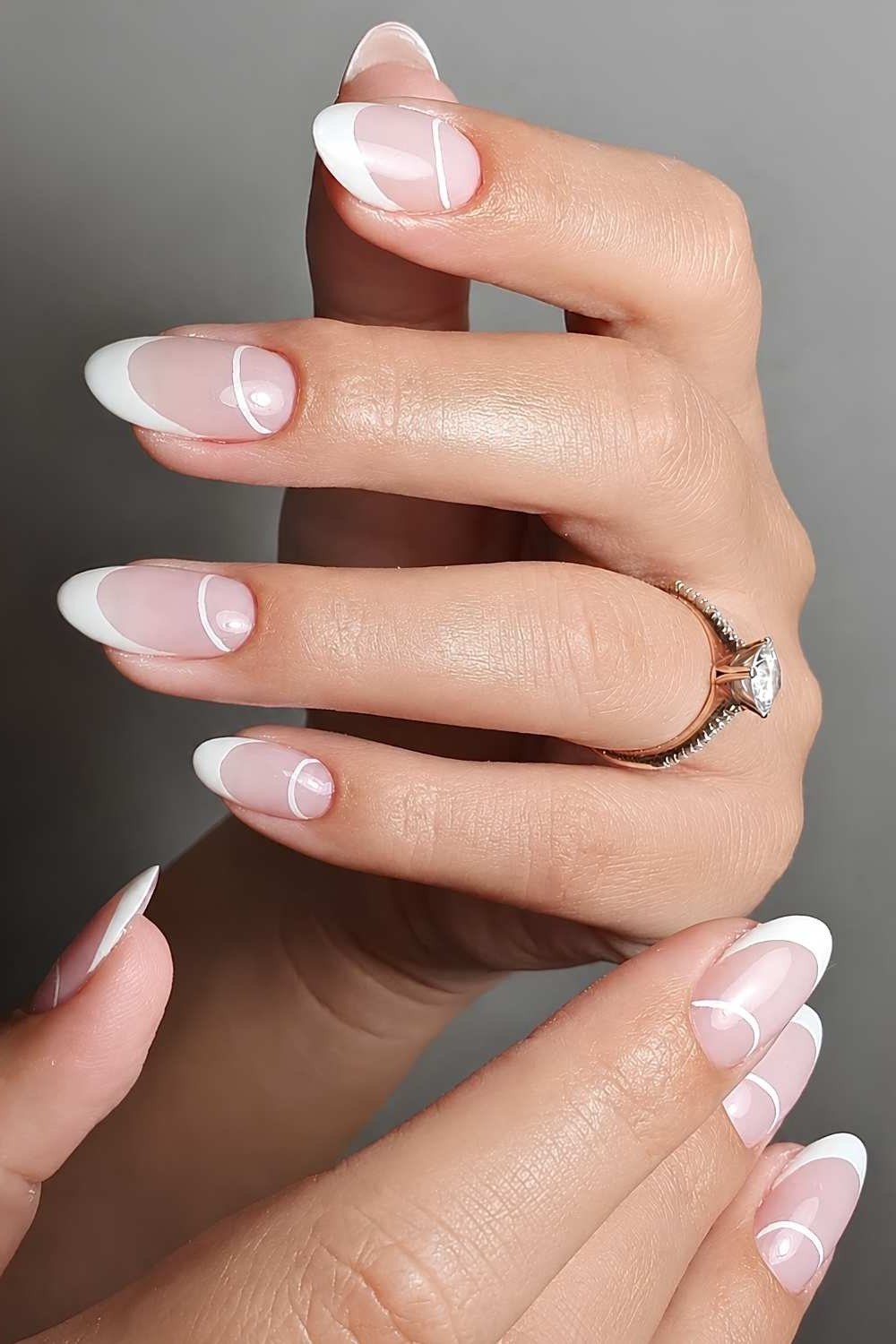Almond french tip with thin ring, pink base - flattering nail idea for women over 50