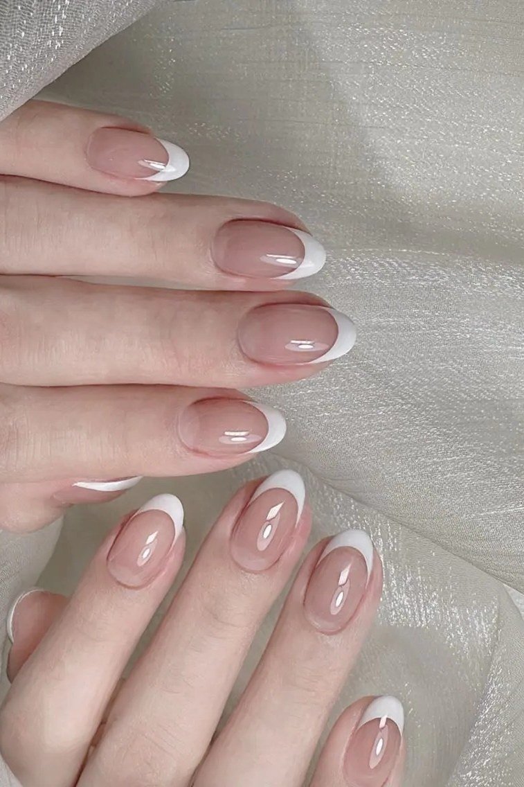 Short french tip on white silk - flattering nail idea for women over 50