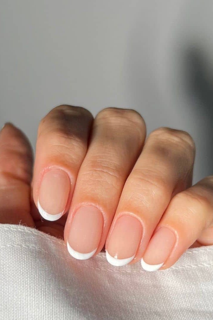Short squoval white french tip - flattering nail idea for women over 50