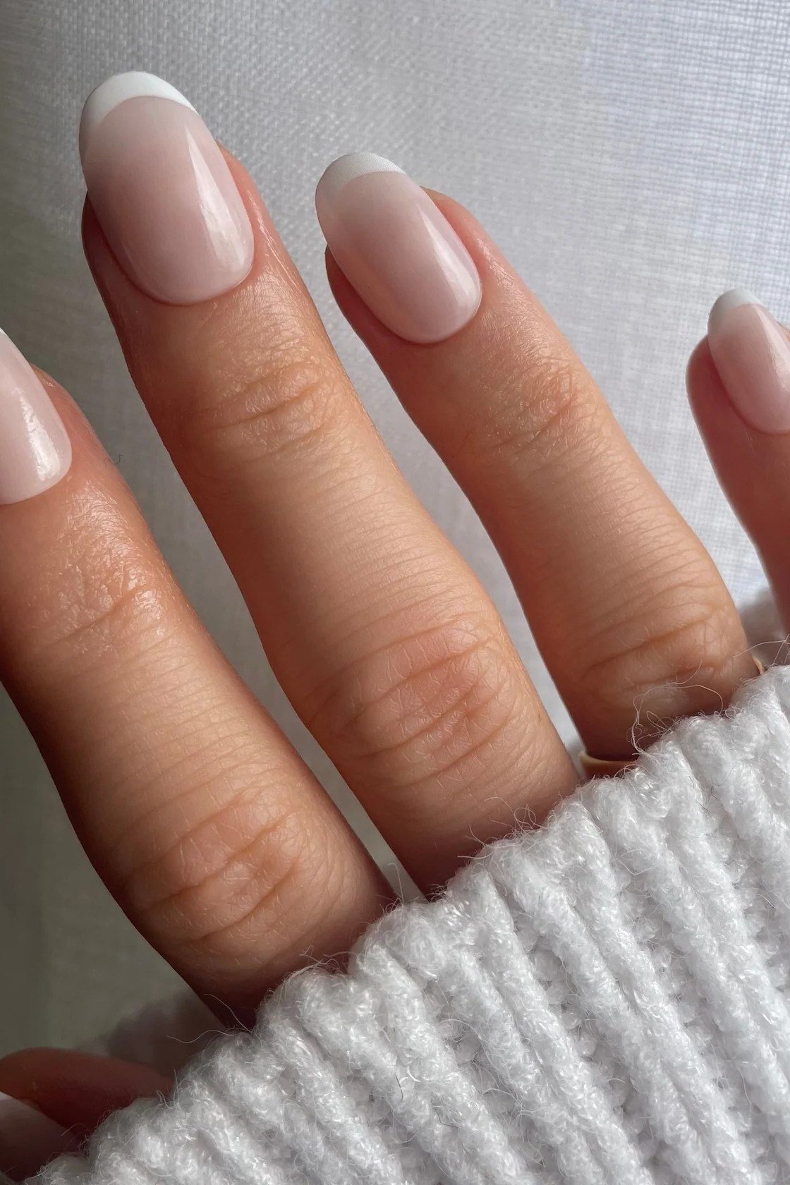 Long nude oval plain polish - flattering nail idea for women over 50