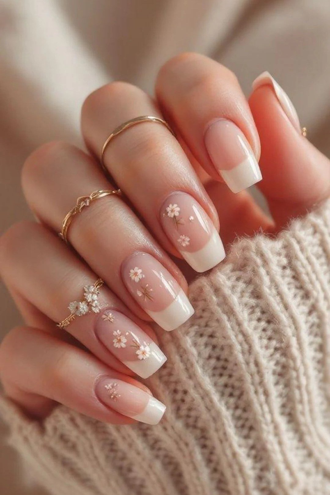 French tip with daisy art, sweater - flattering nail idea for women over 50