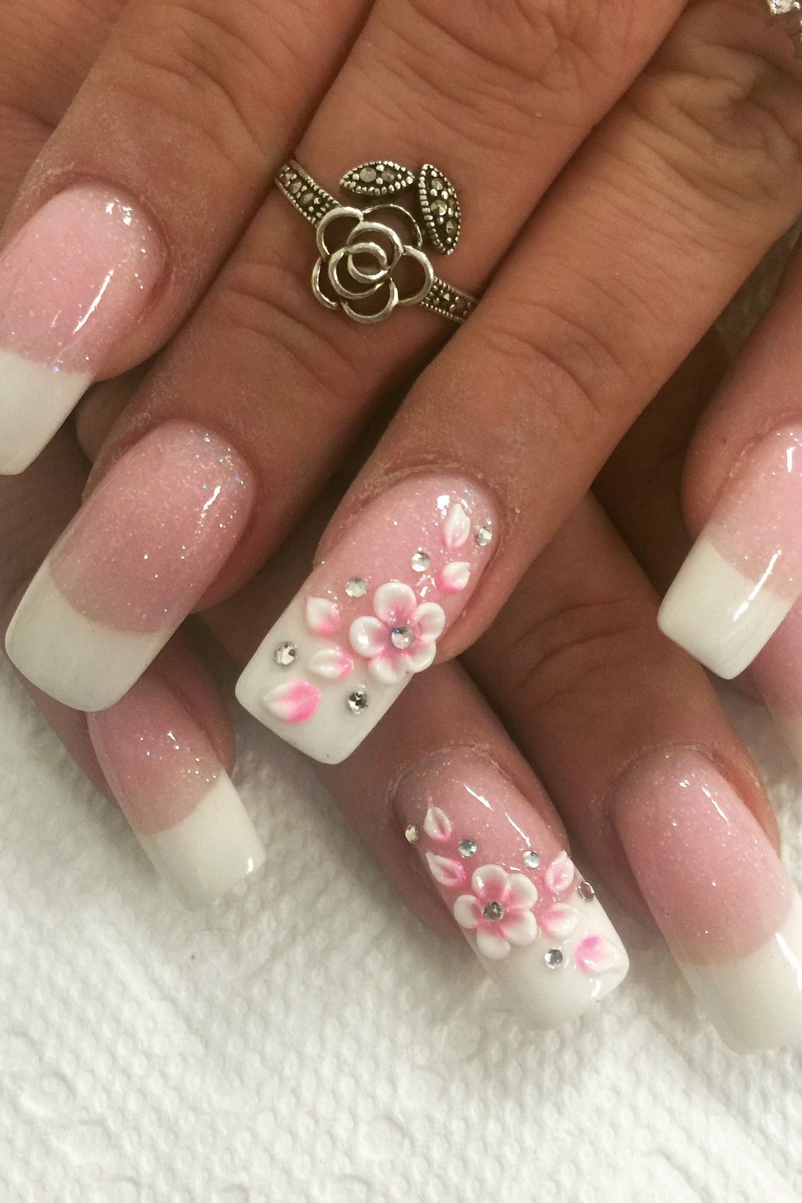 Pink french square with floral art - flattering nail idea for women over 50