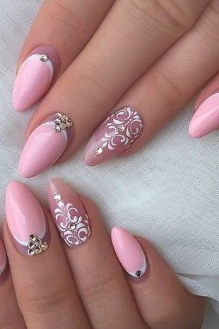Pink almond with white lace art - flattering nail idea for women over 50
