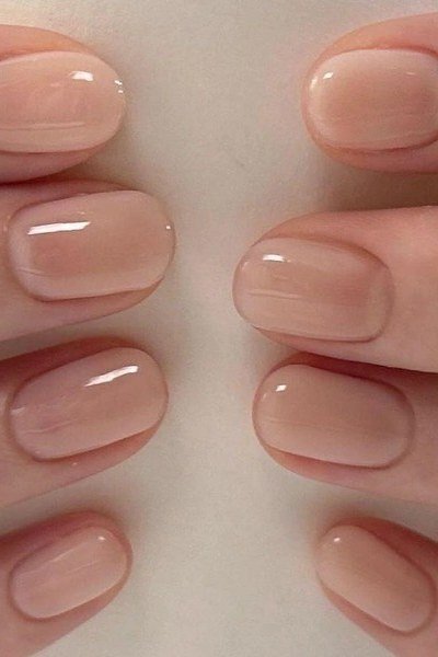 Glossy nude short square, both hands - flattering nail idea for women over 50