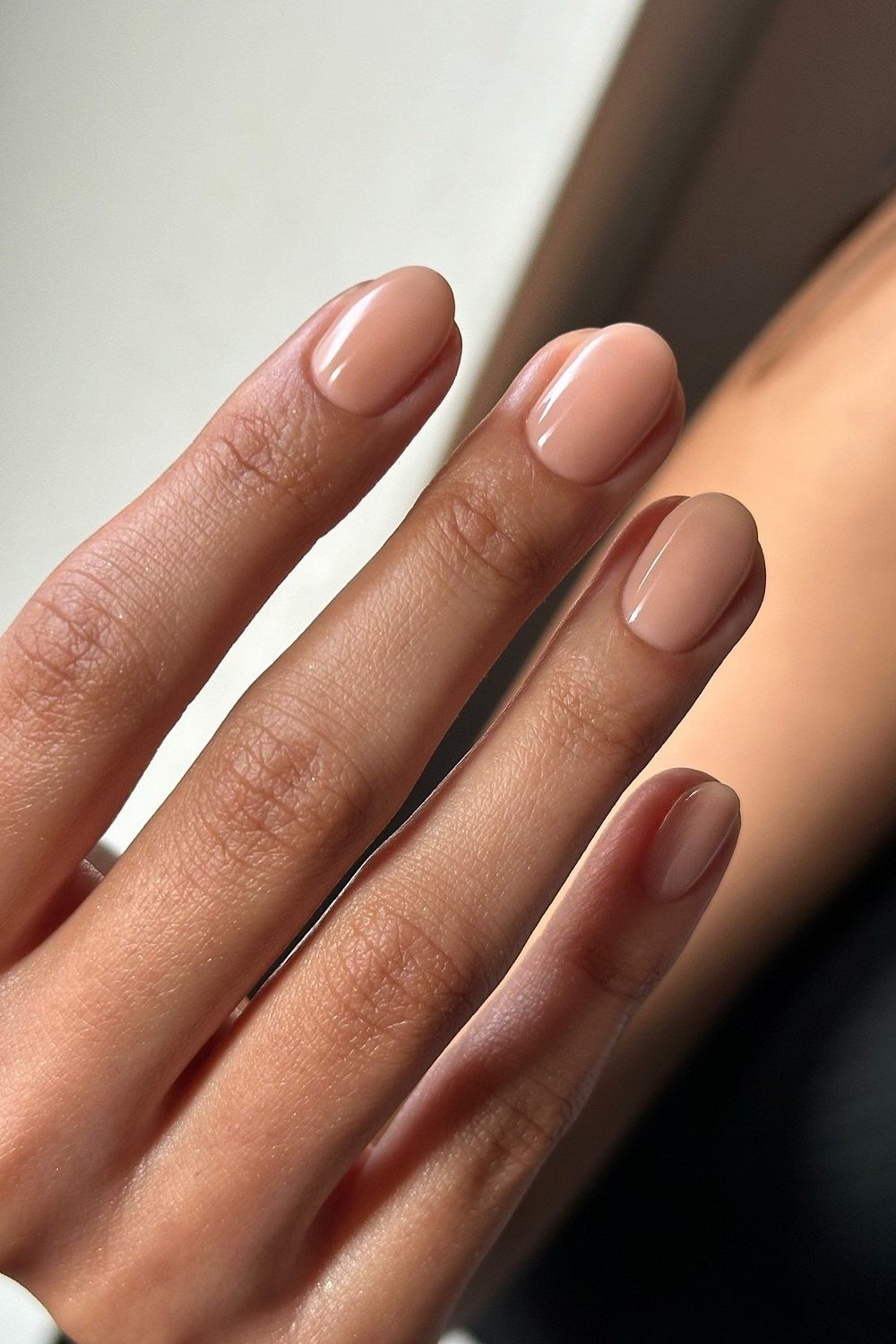 Nude oval on brown skin - flattering nail idea for women over 50