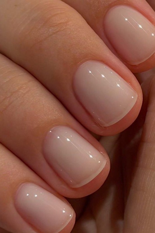 Short oval taupe nude nails ultra glossy macro for women over 50