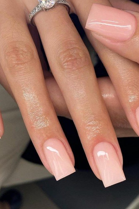 Long coffin pink nude nails with rings for women over 50
