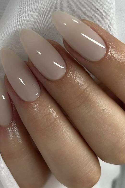 Almond taupe nude nails ultra glossy macro for women over 50