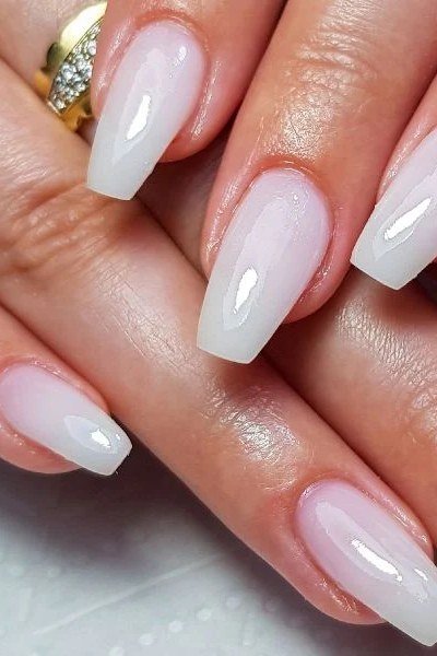 Medium almond milky white to pale pink nails for women over 50