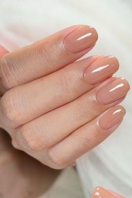 Medium almond warm nude nails high gloss for women over 50