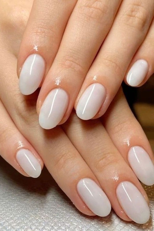 Medium round milky white nails glossy two hands for women over 50