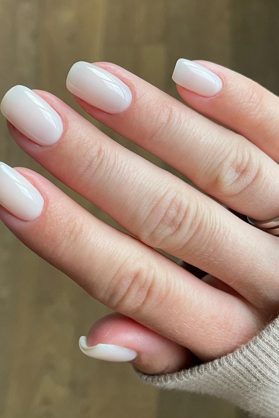 Medium round milky white nails with diamond ring for women over 50