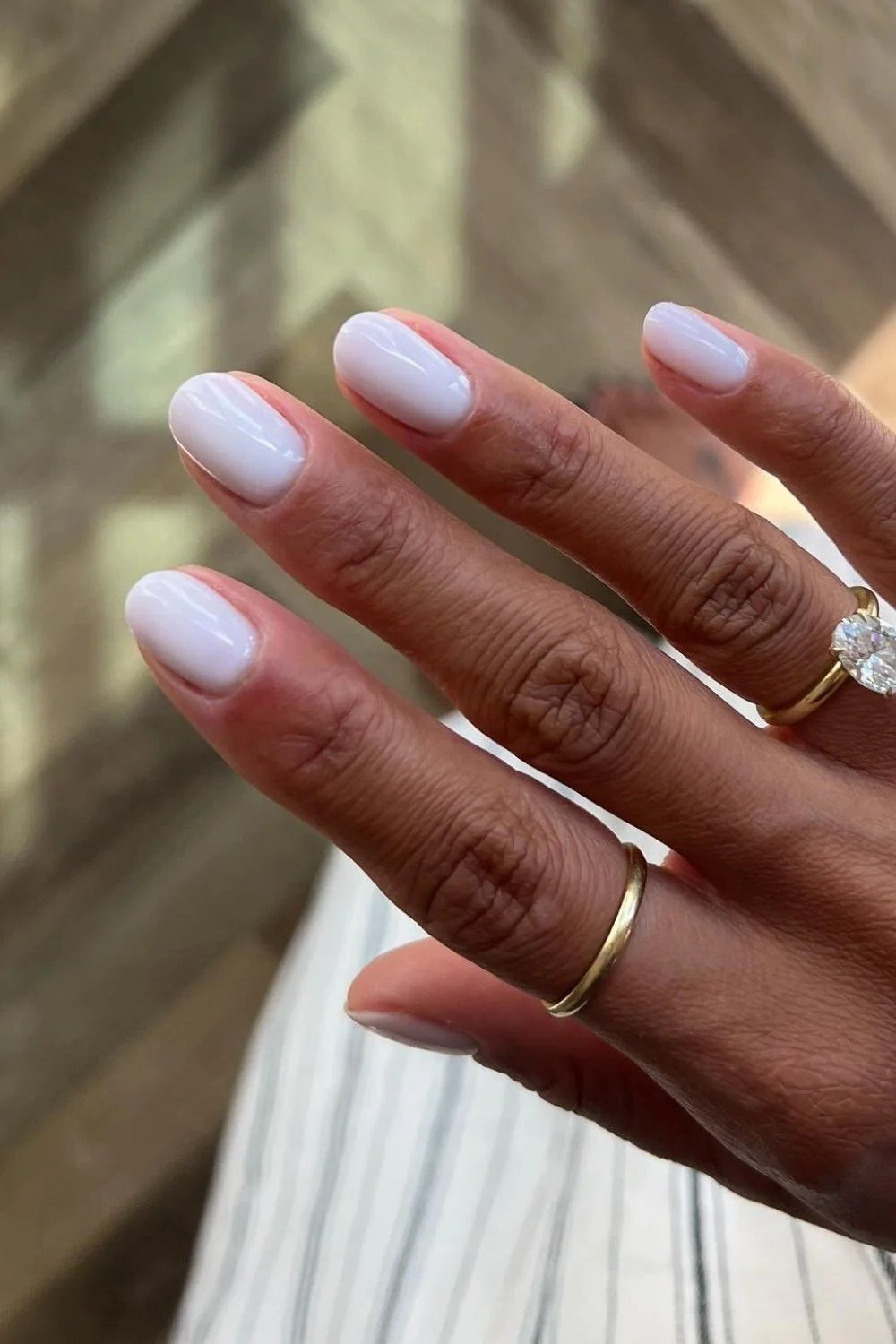Medium almond milky white nails relaxed hand for women over 50