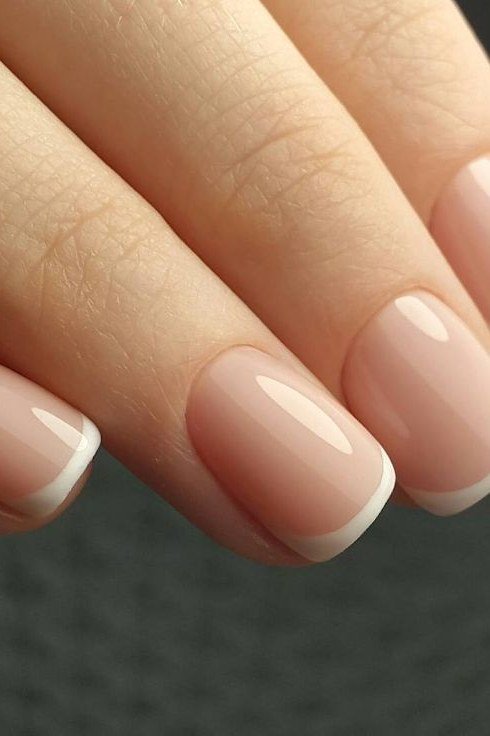 Squoval milky nude french tip nails glossy macro for women over 50