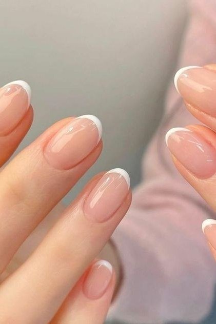 Classic pink french tip nails sharp macro for women over 50