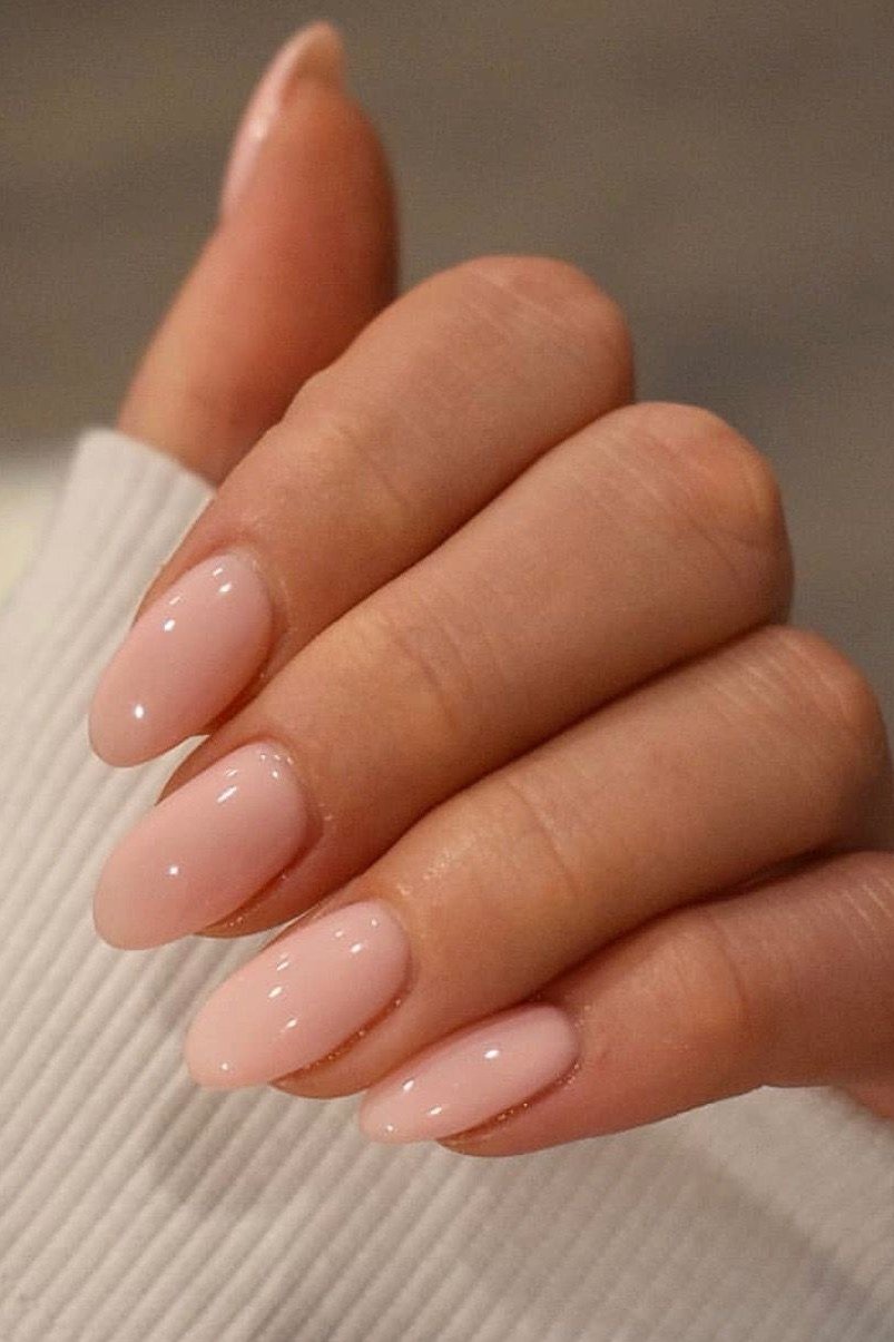 Pink nude almond nails glossy close-up for women over 50
