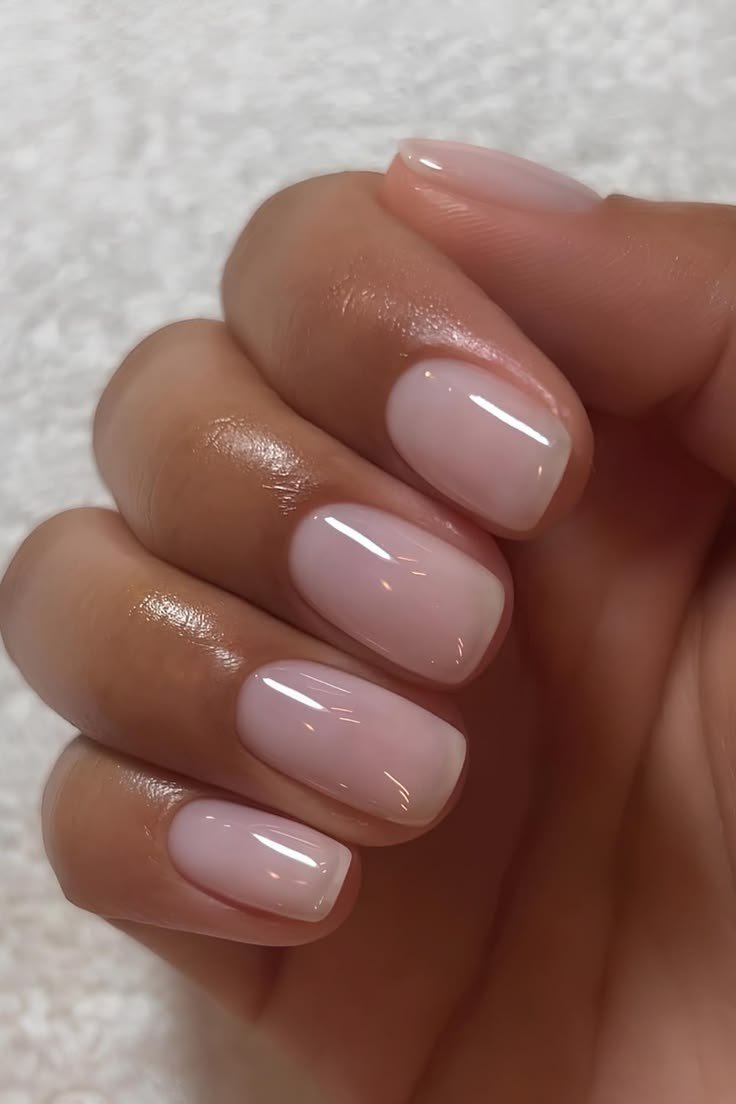 Glossy nude oval nails macro close-up for women over 50