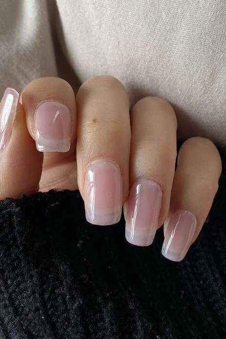 Sheer milky white square nails soft close-up for women over 50